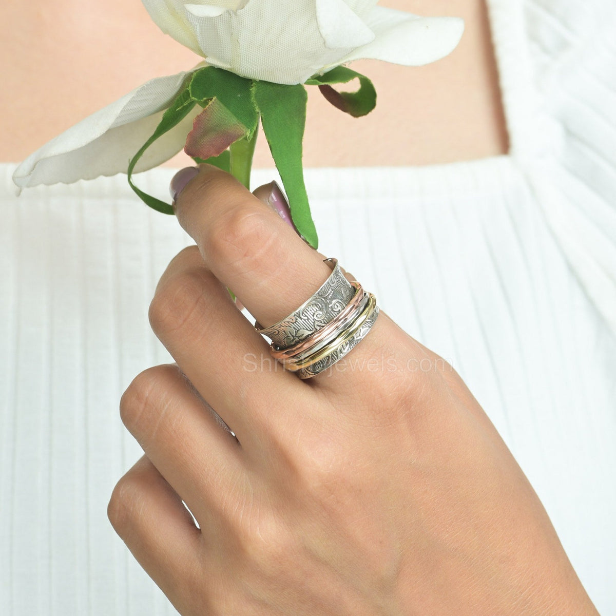 Mixed metal fidget ring with artisan twist wire design